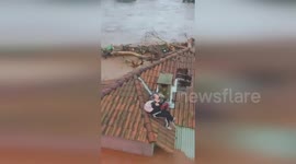 Helicopter rescues couple stranded on roof during Brazil floods