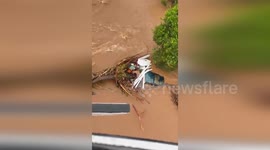 Brazil: Dramatic Rescue Saves Couple and Dog Trapped Atop Debris
