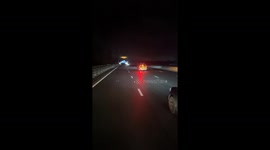 National Highways Officer vehicle displaying do not pass with flashing beacons on the M4 going eastbound at night