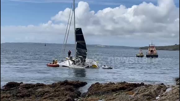 RNLI attempt to rescue sinking sailing boat and passengers  in Cornwall
