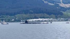 UK submarine doing a cold move between bases on Loch Long in Argyll Scotland