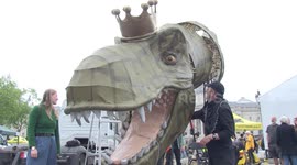 Anti-monarchy protesters bring GIANT DINOSAUR wearing a crown to Trafalgar Square in London