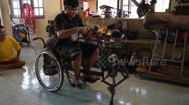 Thai man builds wheelchair with two front legs for navigating bumpy roads