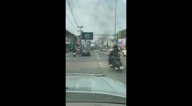 Motorbike bursts into flames in traffic in Thailand