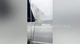 Strong wind batters buildings and topples power pole in southern Thailand