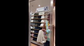 Father and daughter play in shop mirror
