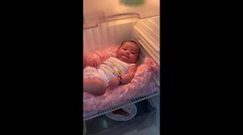 Baby cools off in fridge during Philippines heat wave
