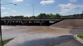 USA: Nolan Creek Submerges Interstate 35 Access Road in Belton, Texas