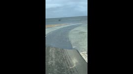 Flooding road: clear waters over Cape Cod, Massachusetts