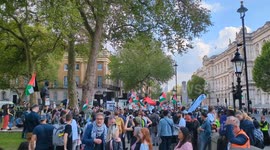 Pro-Palestinian protestors prepare to march in London against UK government support of Israel's attacks on Palestine