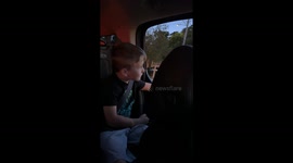 Kid Catches Sight of Adult Performance in Window