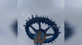 Tourists stuck upside down hundreds of feet in air when fairground ride broke