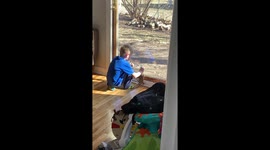 Innocent moment: Dalton Introduces Phoenix the lizard to the outside world