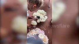 Mum designs stunning dress made of 210 fresh flowers