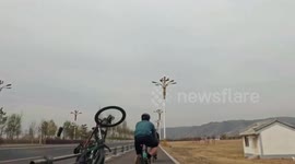 Cycling crashes into road rail barrier