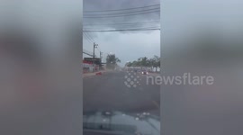 Storm blows market stalls onto road in eastern Thailand