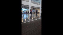 Family Rides Scooter Suitcases Through Airport