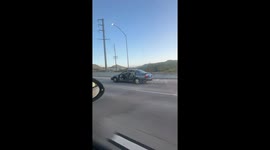 Car Missing All Four Doors Driving on Highway