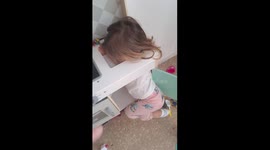 Girl Gets Stuck in Play Kitchen Sink