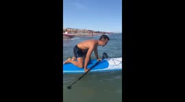 Guy Struggles to Balance on Paddleboard