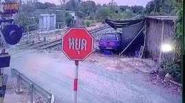 Two injured when level crossing barrier fails and train crashes into pickup truck