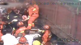 Two people in car miraculously survive run over by lorry