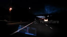 Police car hogs the middle lane on the M6 motorway