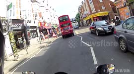 Pedestrian crossing the road in front of bus