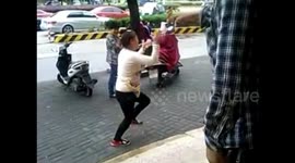 Woman swears at neighbour on street