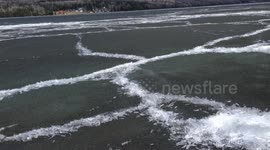 Man brings out his camera at the right time to film lake ice transforming itself into cylindrical shapes