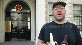 Man eats banana erotically outside Chinese embassy in protest over ban