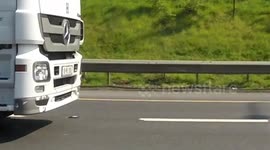 Trunk Driver talking on the Phone while driving with his Elbow M50 Dublin Ireland