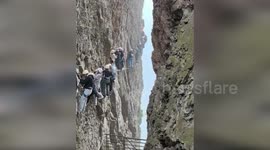 Tourists stranded for up to two hours on terrifying cliff face climb