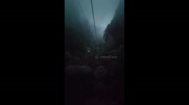 Misty Mountain Descent: Nighttime Cable Car Ride in China