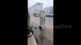 Chinese woman narrowly escapes lightning strike while filming rain