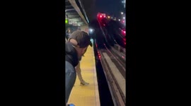 Man's daring stroll along train tracks leaves onlookers in shock