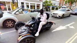 A Fully Face Covered Biker Riding A Super Bike Seen In Chelsea