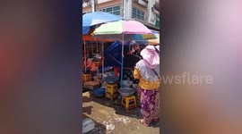 Old ladies selling vegetables start fighting at market in Cambodia
