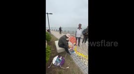 Creative pensioner flys kite made from plastic bags