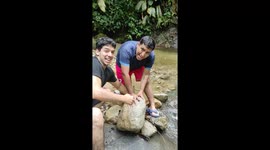 Rocky waterfall challenge: triumph amidst slip and fall