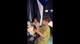 Sibling switcheroo: hilarious game controller mishap
