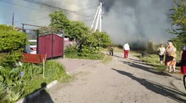 Wild fires burning in the swamp, threat to the house nearby