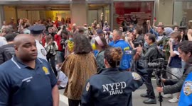USA: Palestine supporters chant for arrested protester as NYPD police line both sides of the Street