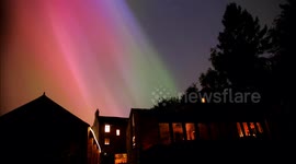 Spectacular Timelapse footage of the Aurora Borealis (Northern Lights) solar storm from the sun & shooting stars ablaze with green, orange, red & pink colours over the Derbyshire Dales, UK.