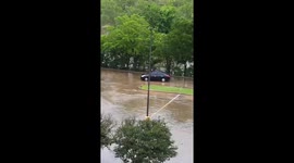 Driver ignores flood warnings, plunges car into creek