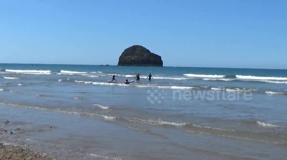 Trebarwith Strand in the heat wave , the sea is ``mediterranean`` in appearance and the kids are loving it