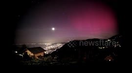 Aurora Storm , Red, pink , green, blue northern lights seen near Montreux Switzerland in 4K realtime video