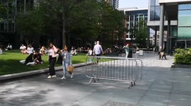 Londoners enjoy the sunshine in the East End of London near Liverpool Street