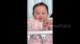 China: Baby Tries Baked Sweet Potato for the First Time