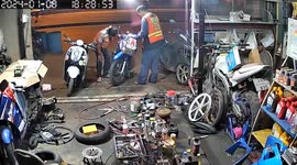 Bungling riders accidentally start motorcycle at repair shop